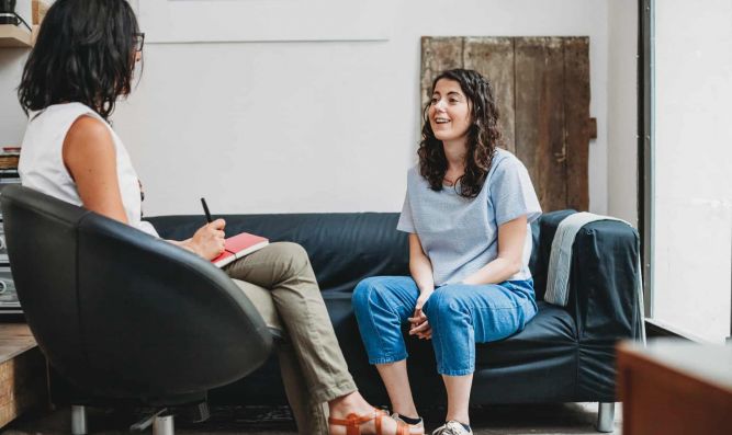 Psychotherapy session, woman talking to his psychologist in the